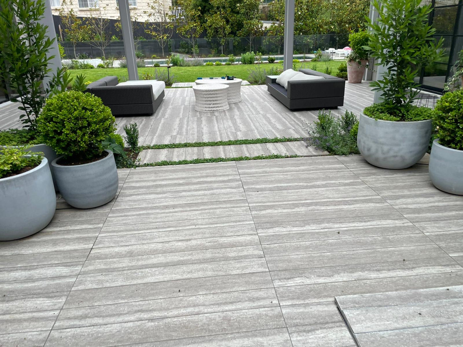 Large format porcelain tiles on a sealed outdoor alfresco terrace