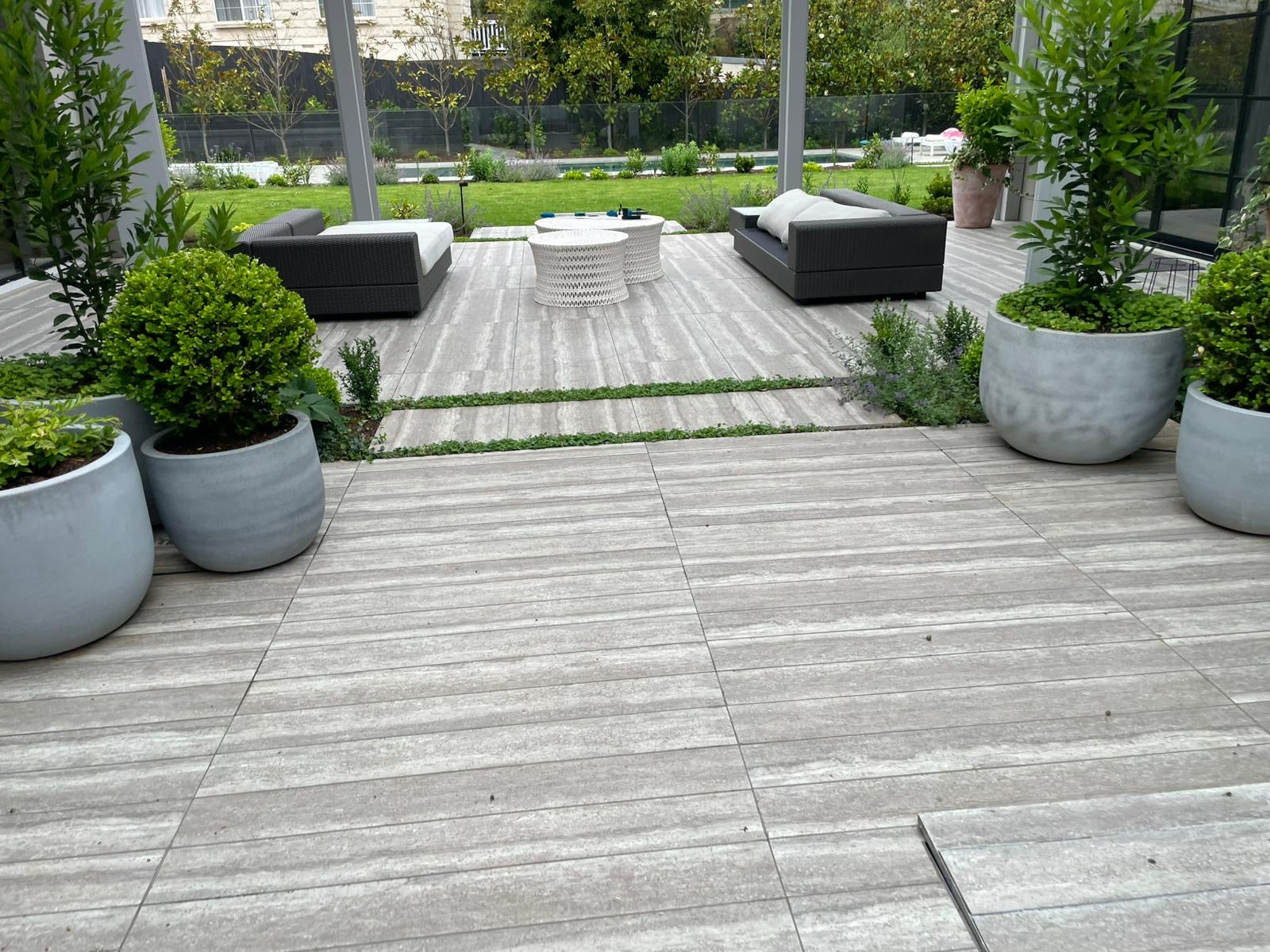 Large format porcelain tiles on a sealed outdoor alfresco terrace